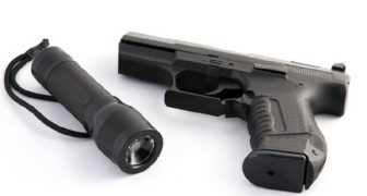 How to Use a Flashlight with a Handgun